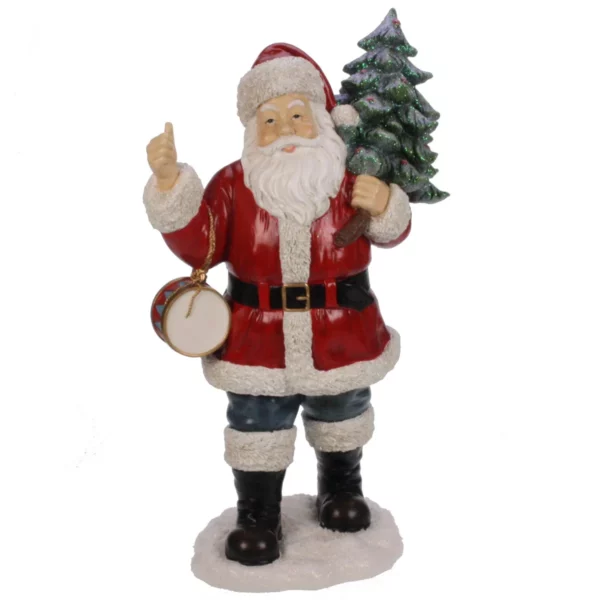 Kerstman met trommel en boom