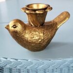 Kandelaar vogel goudkleurig, sfeerfoto